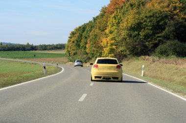 Car driving on the road clipart