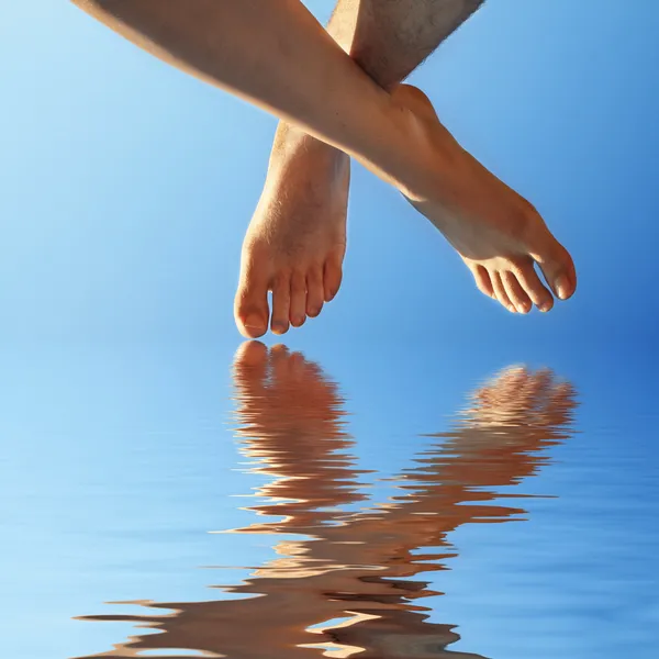 Female and male walking on water — Stock Photo, Image