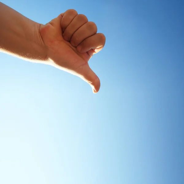 stock image Thumbs down on a blue background