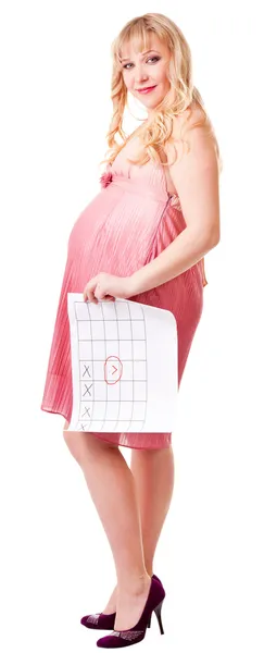 Woman holds a birth calendar — Stock Photo, Image