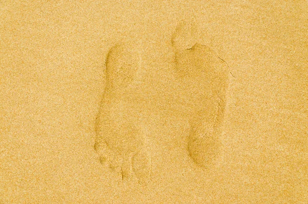 Emberi lábnyom a homokban — Stock Fotó