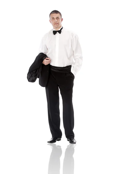 El hombre elegante en un esmoquin clásico sobre un fondo blanco —  Fotos de Stock