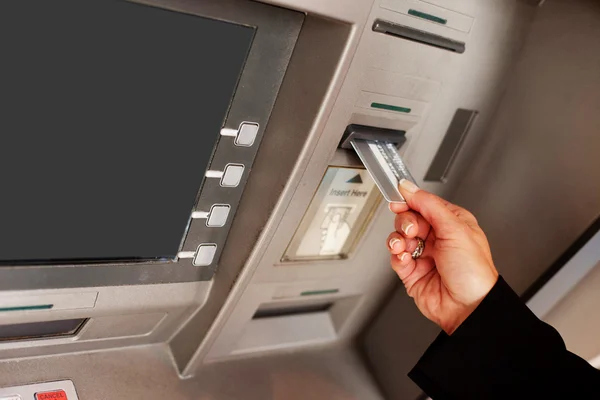 Woman with money at automatic teller — Stock Photo, Image