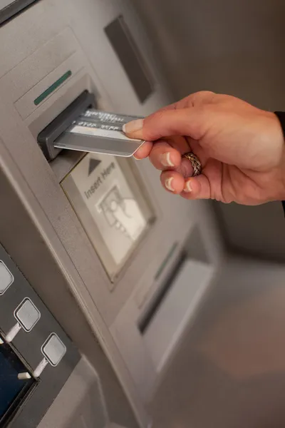 Woman with money at automatic teller — Stock Photo, Image