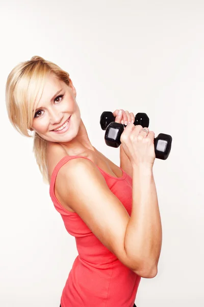 Fit woman lifting dumbbells — Stock Photo, Image