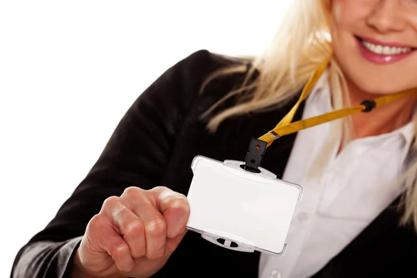 Businesswoman holding up her blank ID tag — Stock Photo, Image