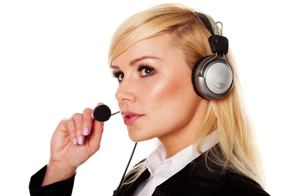 Vrouw met hoofdtelefoon en microfoon Stockfoto