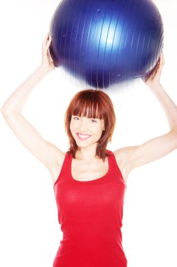 Smiling Woman Holding Pilates Ball clipart