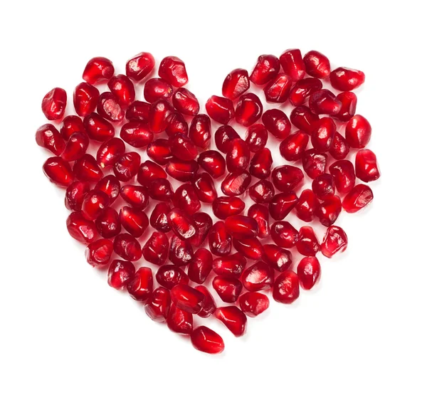 Heart shaped pomegranate seeds — Stock Photo, Image