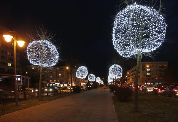 stock image Trees are decorated with lights on the boulevard