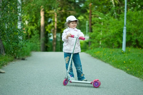 stock image Girl with a scooter.