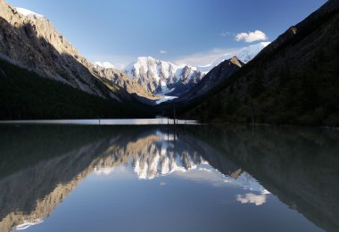 Masej lake and valley and rock face - altai mountains clipart