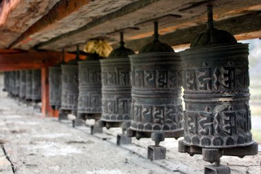 Many prayer wheels clipart