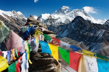 View of everest from gokyo ri with prayer flags clipart