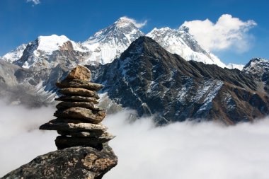 View of everest with stone man from gokyo ri clipart