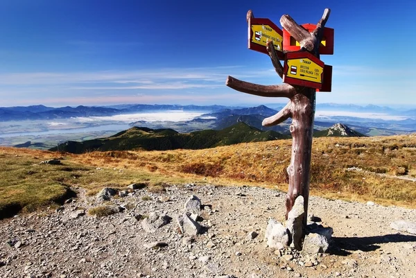 stock image Autumnal view from rohace mountains with guidepost - west high tatra mountains- Slovakia