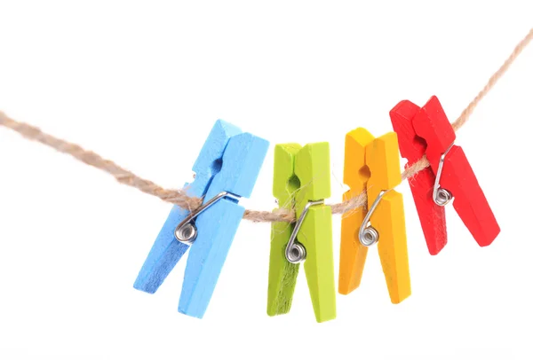Colorful clothespin hanging on white background — Stock Photo, Image