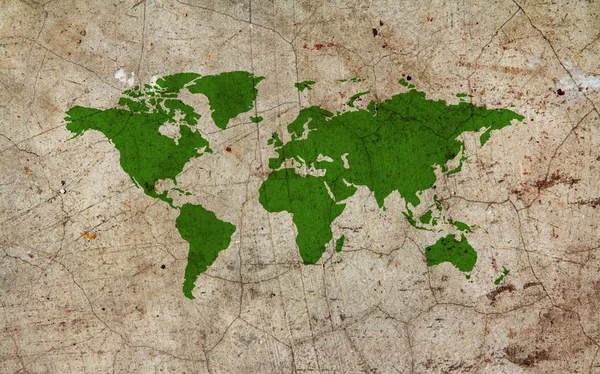 Painted green world map on cement wall — Stock Photo, Image