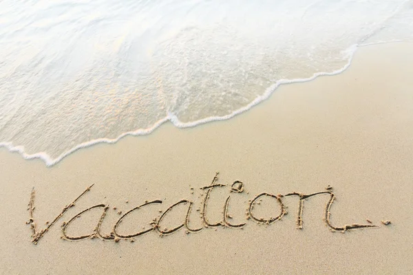 Scrittura di vacanza su una spiaggia — Foto Stock