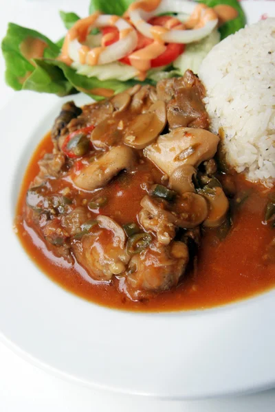 stock image Spicy herb chicken and mushroom serve with rice and salad