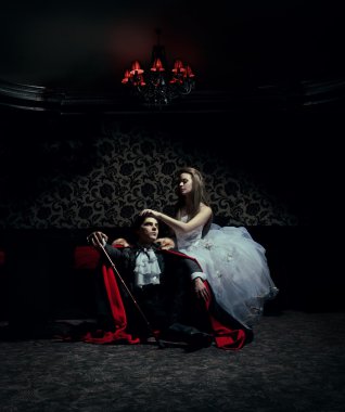 Dark couple resting after the ball clipart