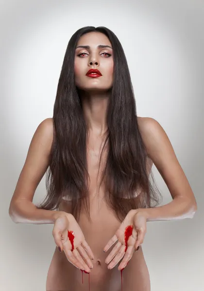 Brunette bleeding woman — Stock Photo, Image