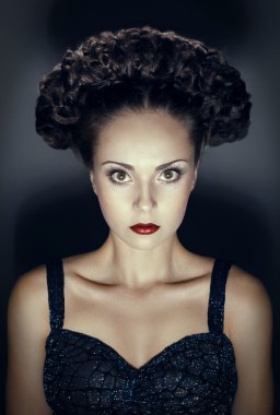 Studio portrait of gothic woman with hairstyle clipart