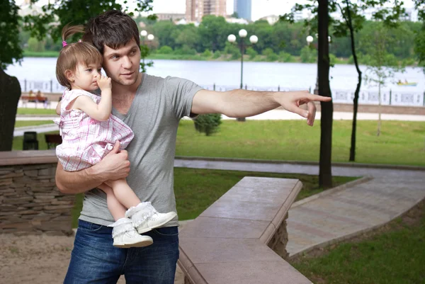 stock image Father and little daughter walking in park