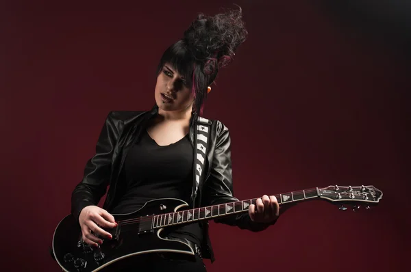 Alternative rock girl with guitar Royalty Free Stock Images