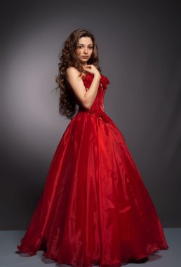 Beautiful long haired woman in red dress clipart