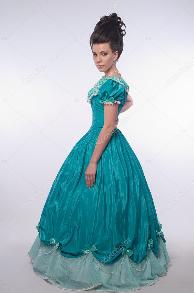 Old fashioned girl in cyan dress