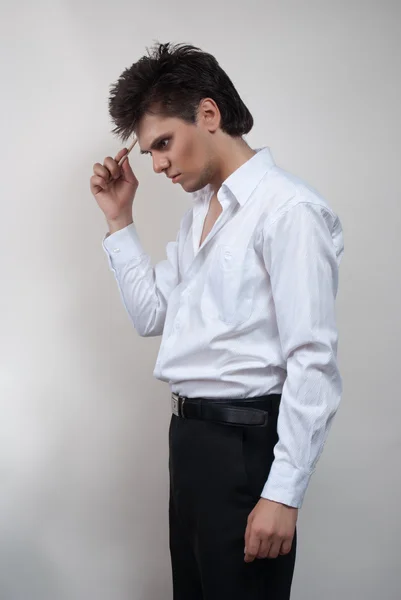 Handsome man in white shirt. Studio white background. Stock Image
