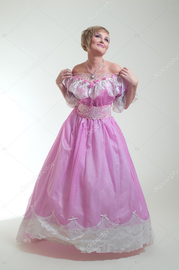 Blond woman in beautiful long pink dress