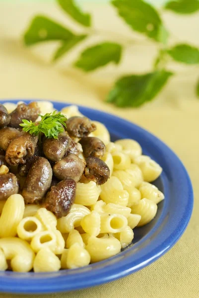 Pasta with chicken hearts — Stock Photo, Image