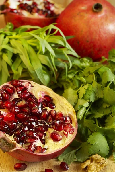 Pomegranate and herbs — Stock Photo, Image