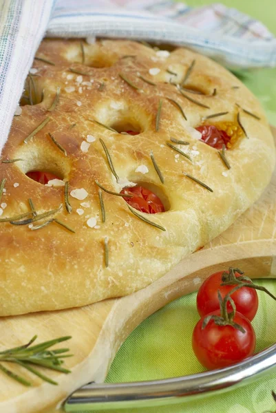 stock image Focaccia bread with cherry tomatoes, rosemary and salt