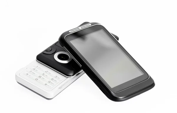 Telefone antigo e novo smartphone no fundo branco — Fotografia de Stock