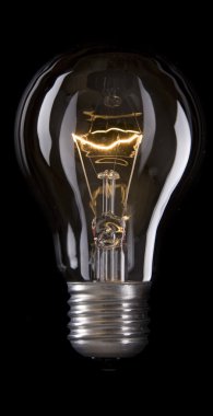 Electric Bulb isolated black background clipart