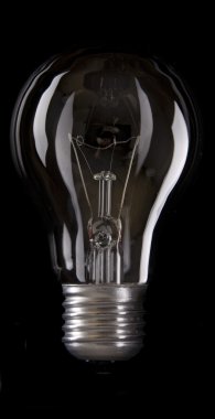 Electric Bulb isolated black background clipart