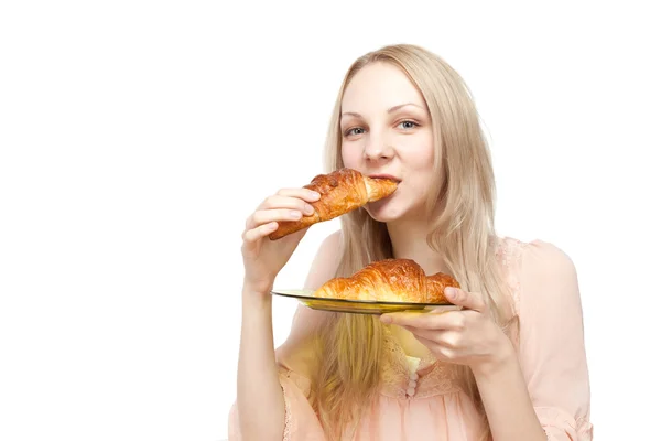 Beautiful healthy woman with croissant — Stock Photo, Image