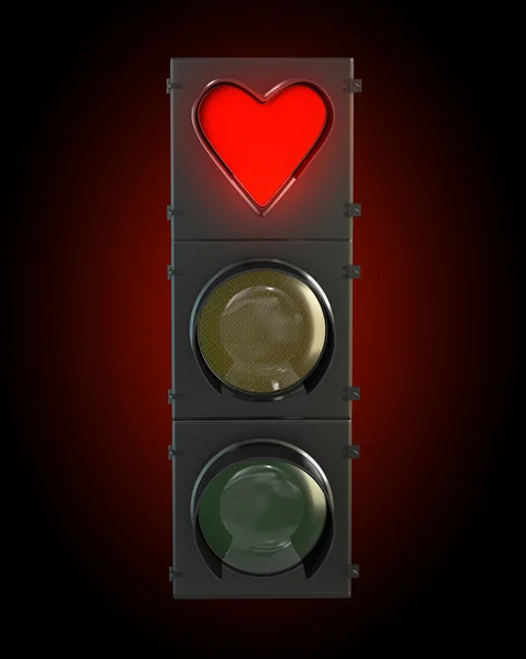 Светофор с красной лампой в форме сердца — стоковое фото