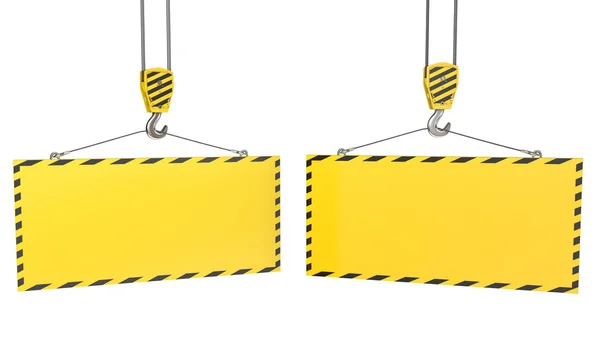 Two crane hooks with blank yellow plates — Zdjęcie stockowe