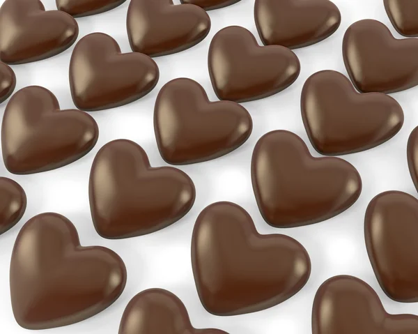 Viele herzförmige Schokoladenbonbons — Stockfoto