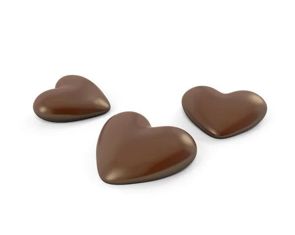 Drei herzförmige Schokoladenbonbons — Stockfoto