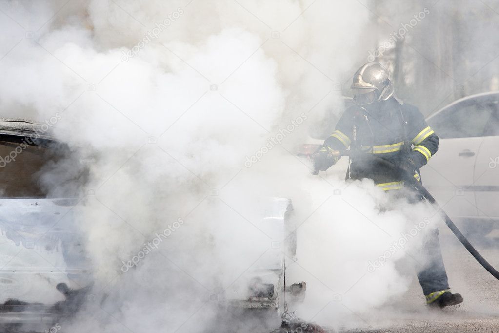 Firefighters between smoke