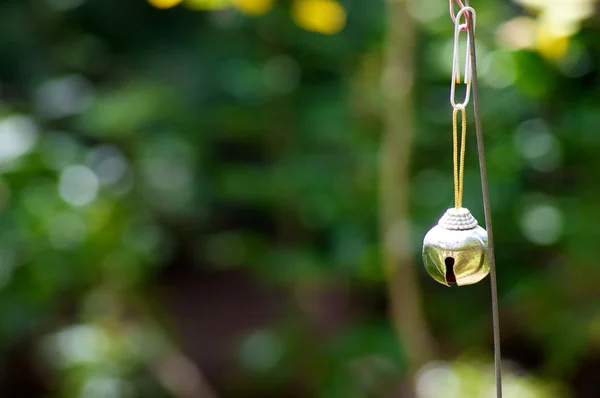 stock image Small brass bell outside