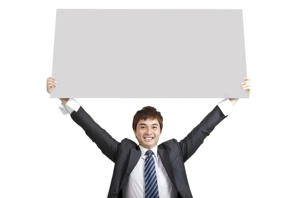 Joven hombre de negocios holding board — Foto de Stock