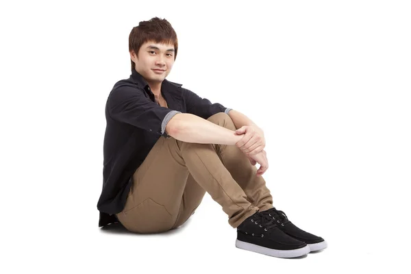 Asian young man sitting — Stock Photo, Image