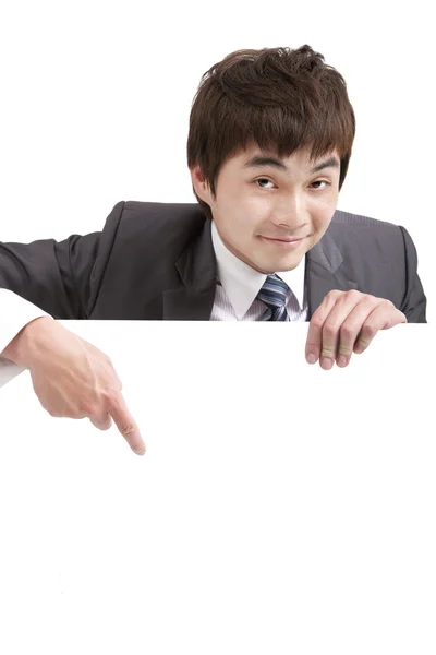Asian businessman pointing empty board — Stock Photo, Image