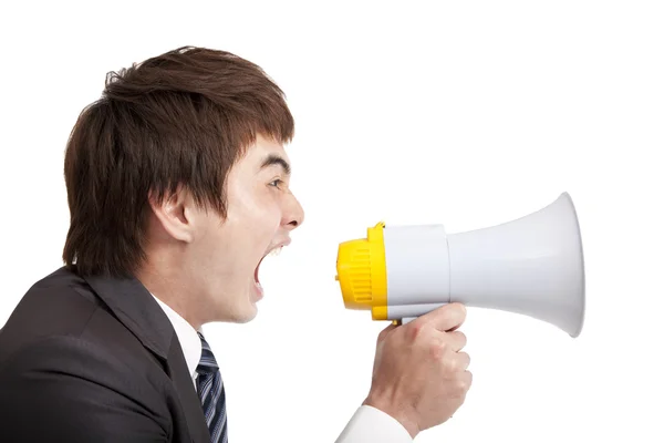 Jovem empresário gritando por megafone — Fotografia de Stock